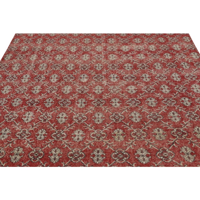 This vintage rug is a 7x11 Turkish distressed piece, made with hand-knotted wool circa mid-20th century. It is an exciting...