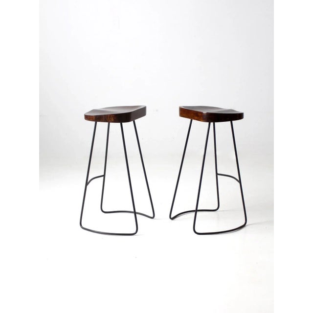 Pair of Vintage Sculpted Wood Saddle Seat Bar Stools With Black Iron Bases For Sale - Image 10 of 11