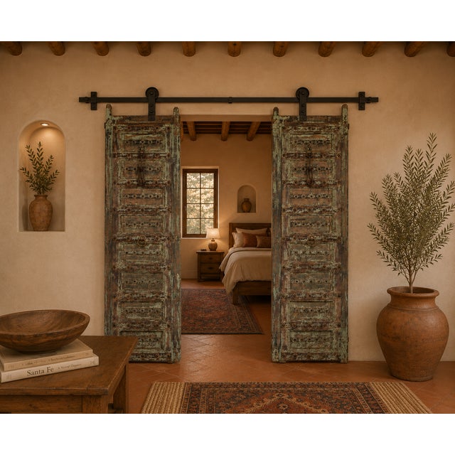 Antique Indian Carved and Painted Teakwood Gujarati Door, each door panel with 8 panels, centered with an iron strap with...