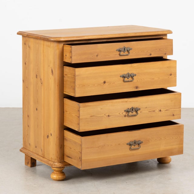 Early 20th century Danish chest of four drawers, crafted in pine with simple clean lines and softly curved front corners....
