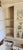 Distressed Antique White French Country Style China Cupboard Hutch With Shelves and Drawers For Sale - Image 9 of 10