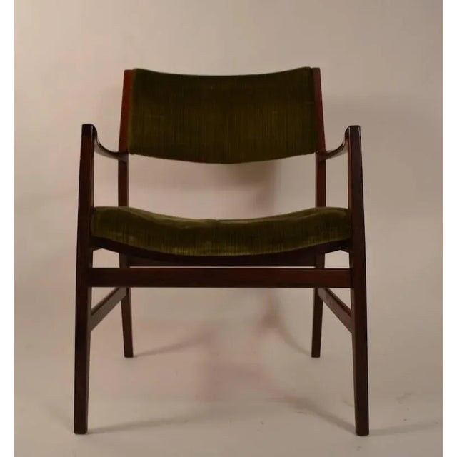 Well designed and constructed rosewood arm chairs, probably Danish, but unsigned. The fabric shows wear and will need to...