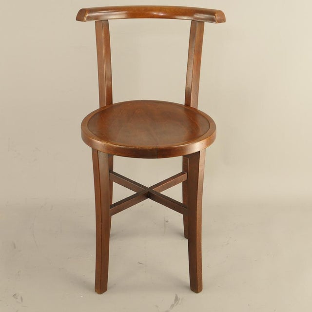 A classic vintage bistro side chair crafted from solid and bent beechwood dating from the early to mid-20th century. The...