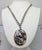 1950s silvertone oval stylized leaves with bumps pendant on a chunky chain with spring ring clasp necklace. Marked...