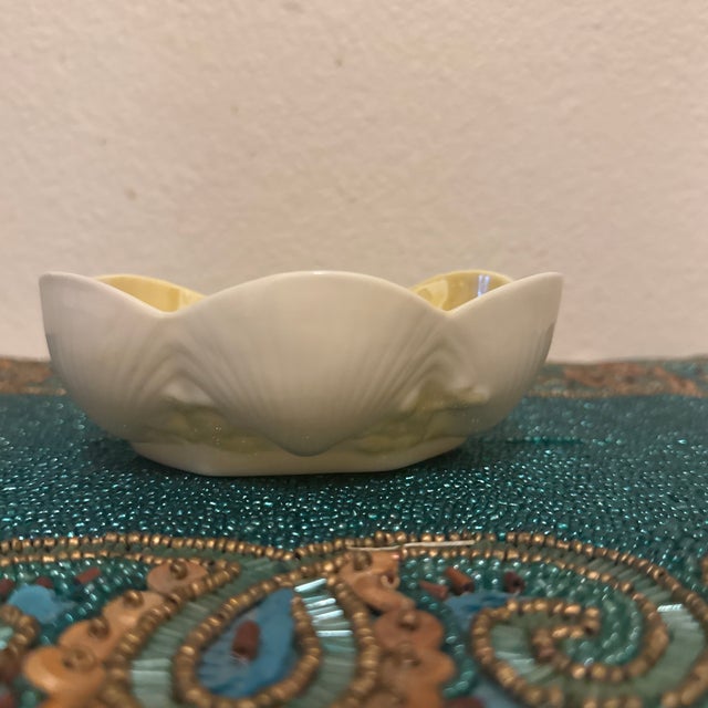 Part of the iconic "New Shell" collection, this delicate small bowl features beautifully sculpted, scalloped seashell...