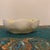 Part of the iconic "New Shell" collection, this delicate small bowl features beautifully sculpted, scalloped seashell...