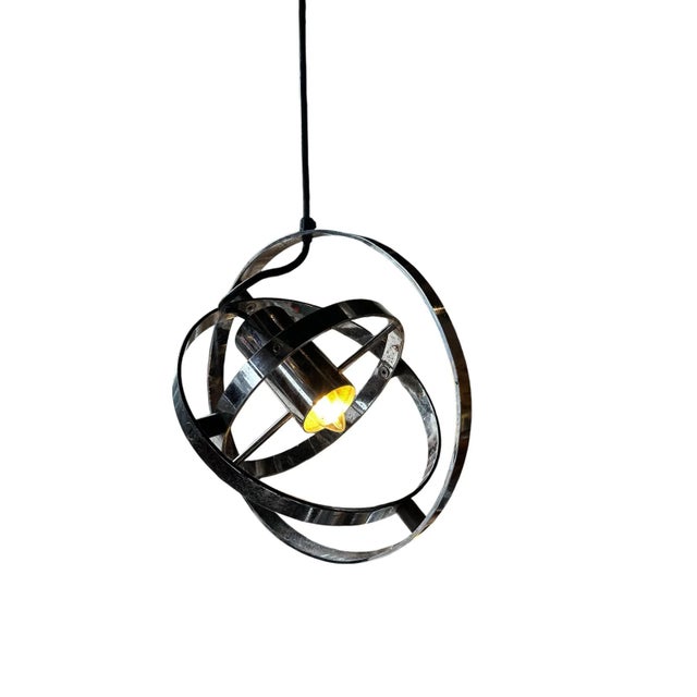 A stunning metamorphic chrome pendant designed by anthony staples and angus wallace for prime move for the design centre...