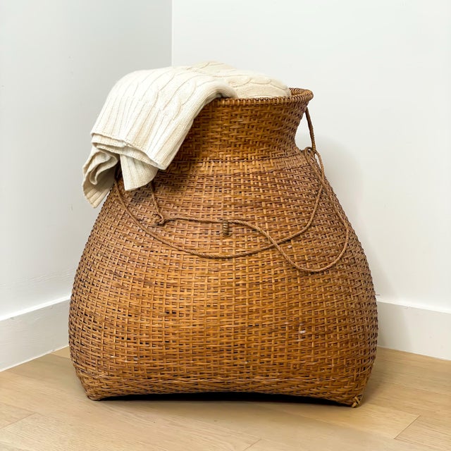 Monumental vintage Asian fish trap basket with beautiful sculptural form and warm natural patina. Handwoven from natural...