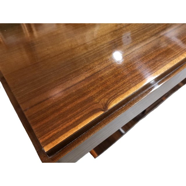 An elegant French Art Deco console table from around the 1930s. It is a well-crafted piece that stands out with its...