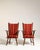 A pair of oak-framed armchairs with upholstered seating, blending Dutch design influence with mid-century simplicity. The...