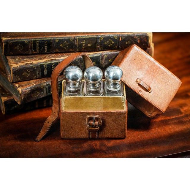 Step back in time with this exquisite Edwardian pigskin leather travel case, meticulously crafted to house three sterling...