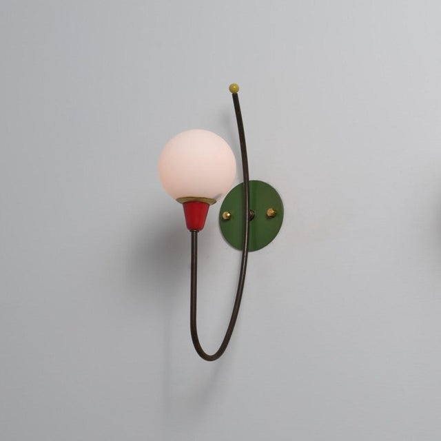 Elegant Italian wall sconce from the 1950s, showcasing a refined Mid-Century Modern design with strong modernist...