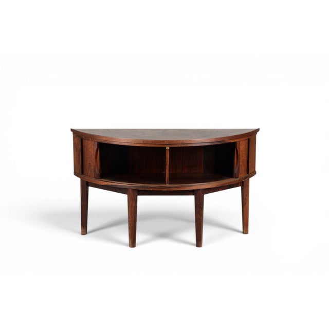 This Danish rosewood hall cabinet brings together the warm grain of rosewood with smooth-gliding tambour doors and a...