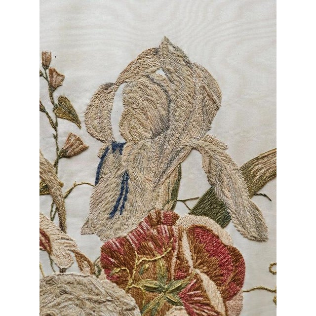 Hand-embroidered painting on silk. Fine work with beautiful details. Original gilded frame with black trim. Date: around...