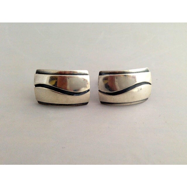 Large scale sterling silver cufflinks with applied wave design created by Paul Lobel of New York, circa 1950's. Cufflinks...