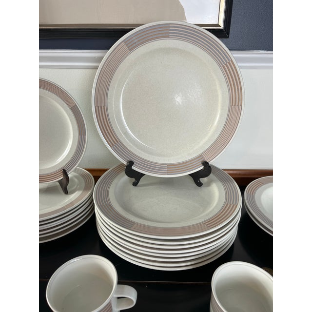 Elegant Mikasa Intaglio Tracings tableware service in luminous white stoneware, distinguished by refined embossed...