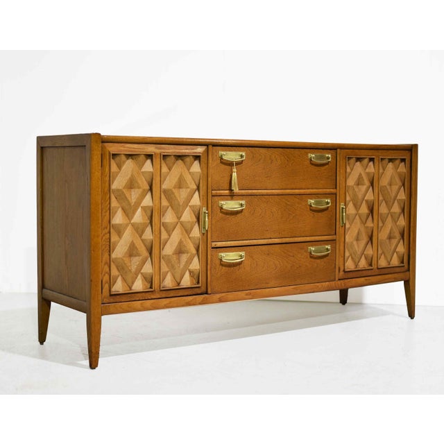 Bold, sculptural, and beautifully crafted, this mid-century modern credenza from Broyhill’s sought-after Premier “Diamond...