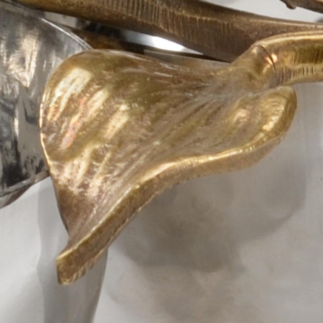 Beautiful hammered stainless steel double bowl with antique brass sculpted orchid. The exquisite details of the orchid...