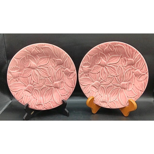 Bring the beauty of Portuguese majolica to your table with this charming **set of two vintage Bordallo Pinheiro Pink...