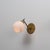 Italian wall sconce dating from the 1950s, characterized by a compact and well-defined composition typical of mid-century...