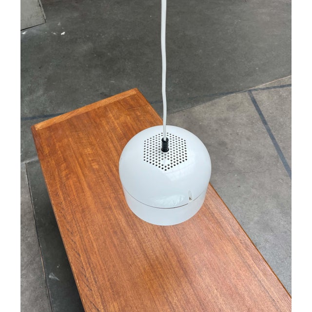 Space Age pendant lamp by the renowned manufacturer Staff, designed by Arnold Berges in the 1970s. The simple lamp body is...