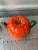 A cute little tea pot perfect for the tomato lover! Is ceramic and painted a vibrant orange/red and green.