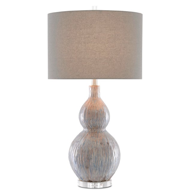 The gourd shape of our Idyll Table Lamp has been realized in porcelain. The striated surface in gray, blue, and taupe...
