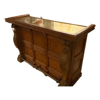 Pulaski Oak Bar With Brass Top and Foot Rail, Griffin Carvings, Plus Custom Inset Oak Doors, Attributed For Sale