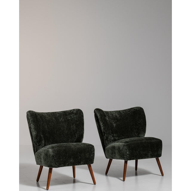 A black wood, Mid-Century Modern-style armchair, dating to the 1940s and made in Denmark. The wood frame is finished in...