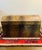 Stylish storage trunk with a faux alligator/crocodile wrap finish. Measures approximately 25.5" x 15" x 15.75" tall. Brass...