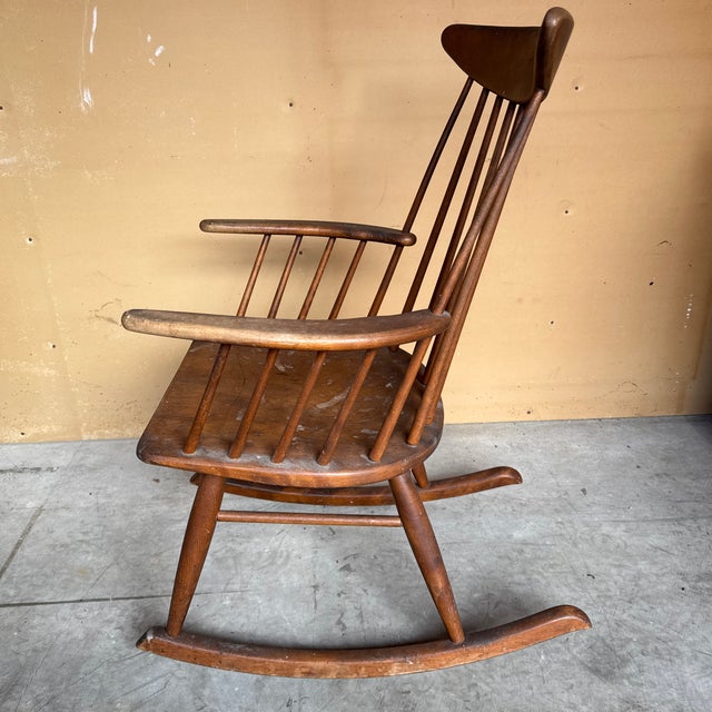 Conant Ball wood rocking chair. Solid and fully functional, but the seat needs refinishing. 36” tall 24” wide at widest...