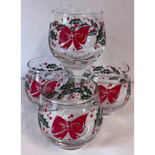 Pretty set of four holiday vintage tumblers by Libbey in the holly and Bow pattern.