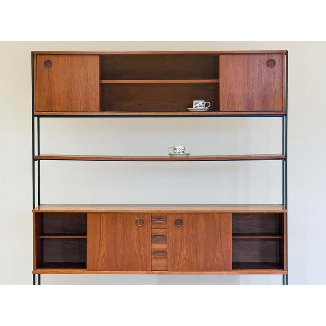 A beautifully crafted modular shelving unit designed by robert heritage for avalon and handcrafted in the uk. the...