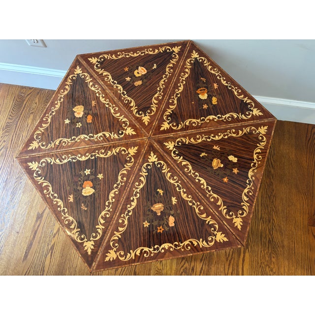 Beautiful set of six vintage Italian marquetry inlaid triangular-shaped tables, c. 1950s. Each table boasts ornate...
