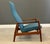 A mid century modern solid teak lounge chair designed by Alf Svensson for Dux in a blue tweed fabric. Made in Sweden....