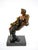 This stunning Mid-Century Modern decorative bronze sculpture captures the elegance and allure of a reclining lady in...