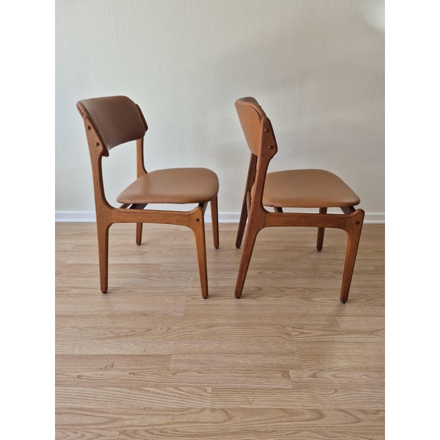 Elegant pair of original Erik Buch model OD49 dining chairs crafted in solid teak in Denmark during the 1960s. The design...