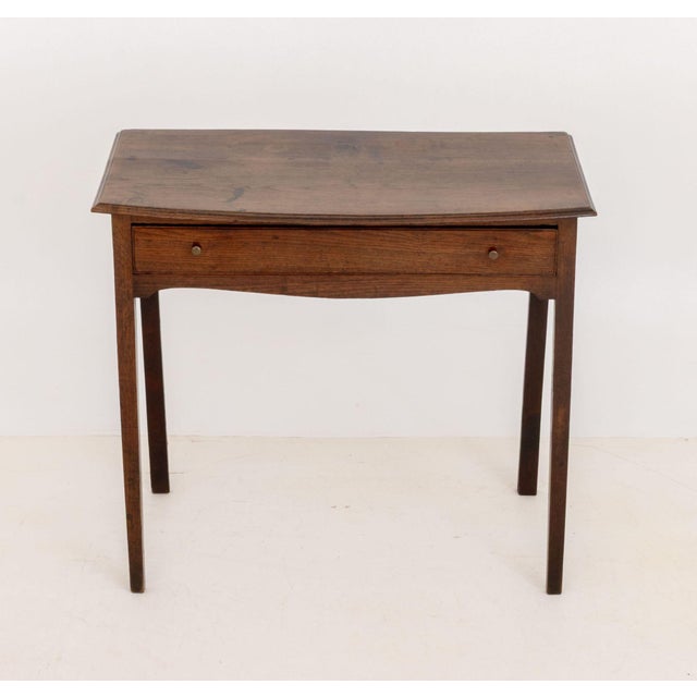 French Provincial Oak Side Table, with single drawer on four tapered legs. 31" H x 35.25" W x 20" D. Provenance: From a...