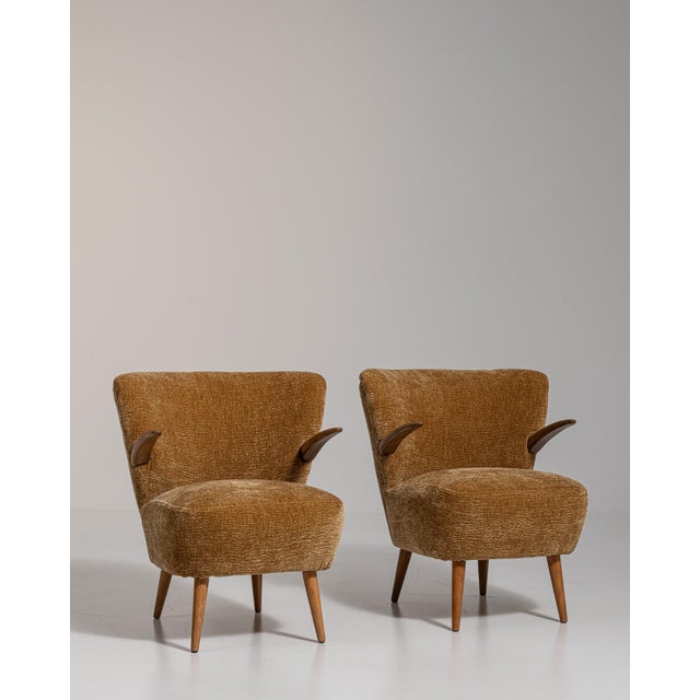 A yellow wood, Mid-Century Modern-style armchair, dating to the 1940s and made in Denmark. The wood frame is finished in...