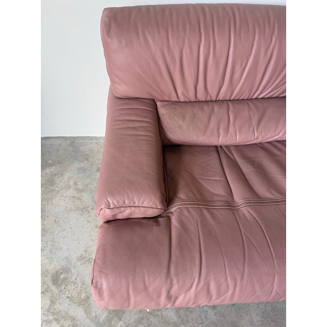 Striking 1980s Italian Postmodern lounge chair by Salotti Natuzzi, crafted in soft pink leather. This sculptural, low-...