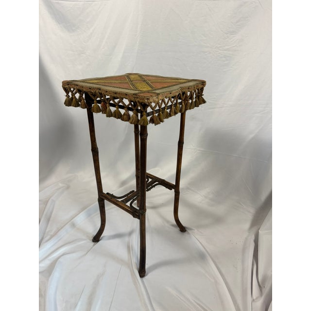 This is an antique French bamboo tabouret (side table/plant stand), Napoleon III in style, with a square top upholstered...