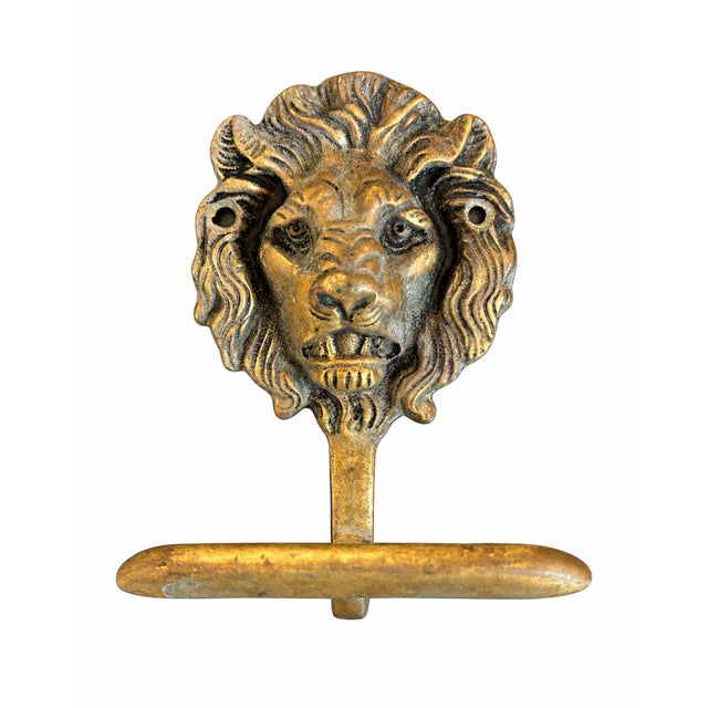A striking vintage solid brass towel hook from France featuring a beautifully detailed lion’s head backplate and a...