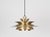 A Scandinavian modernist pendant lamp from the 1960s, crafted from brass with a distinctive multi-layered design. The...