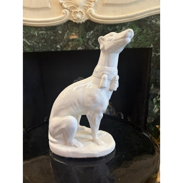Add a touch of classic mid-century elegance to your home with this striking vintage Hollywood Regency style greyhound...