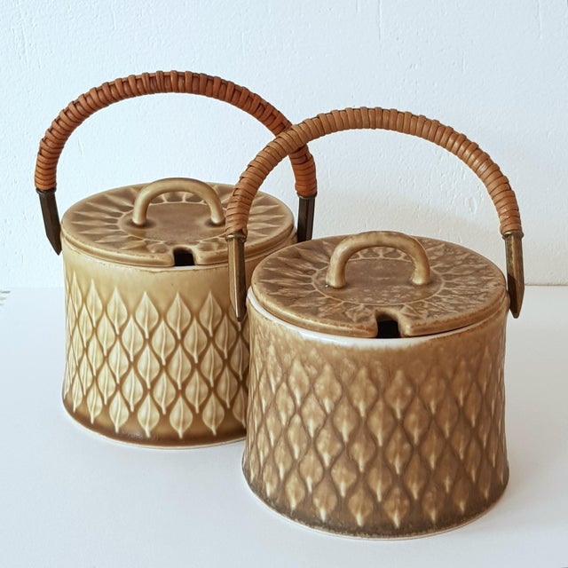 Simple design with excellent workmanship. Matt glazed relief decoration combined with elegant brass handles that are...