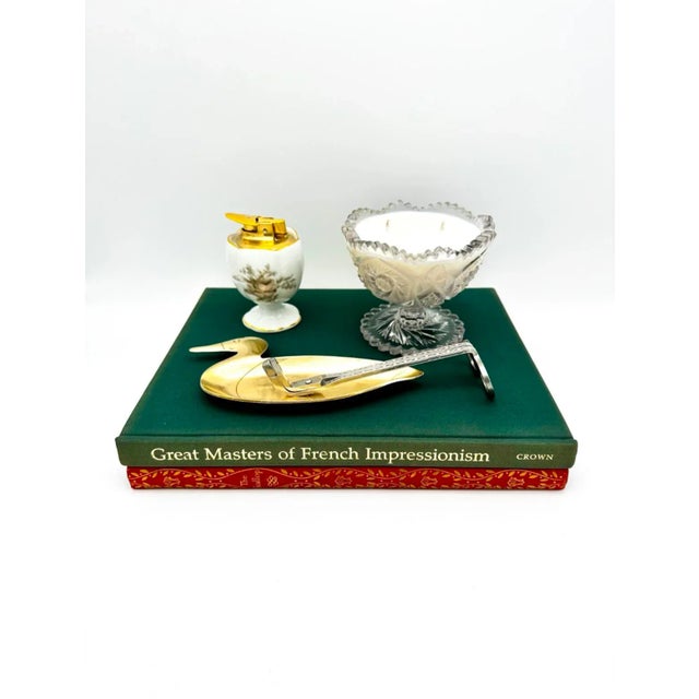 This vintage brass duck trinket dish is a charming addition to any collection. Crafted from durable brass, this dish is...