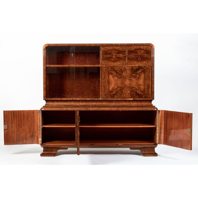 This vintage antique Art Deco burlwood sideboard bar cabinet or secretary cabinet is circa 1930. The cabinet is...