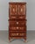 An early 19th century French Louis XVI style marquetry cabinet made of mahogany with inlaid veneers of various exotic...