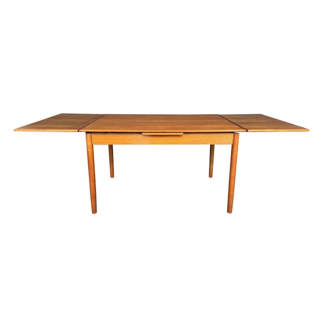 Here is a beautiful scandinavian mid century modern dining table in teak manufactured in Denmark in the 1960's. This...