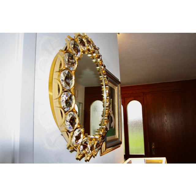 Very beautiful gilt brass mirror by the Austrian Christophe Palma for Palwa, diamond-cut crystal, 5 light points, 1960 I...